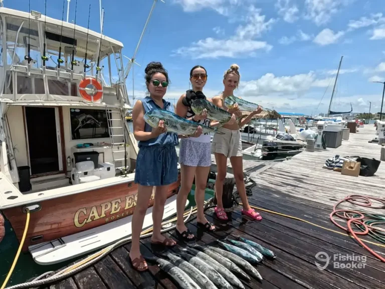 Guests with their catch in front of Cape Escape