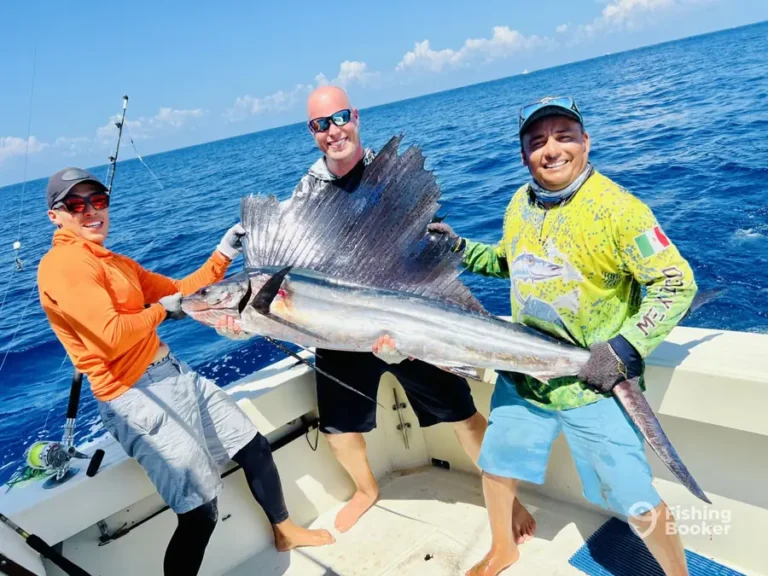 Two families with a sailfish aboard Cape Escape