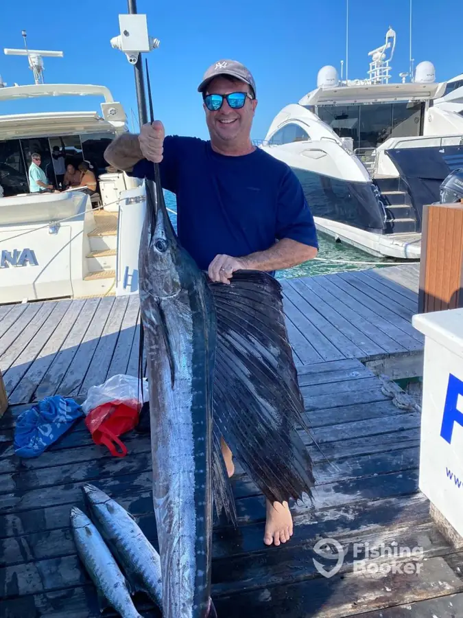 Guest with a sailfish on the dock