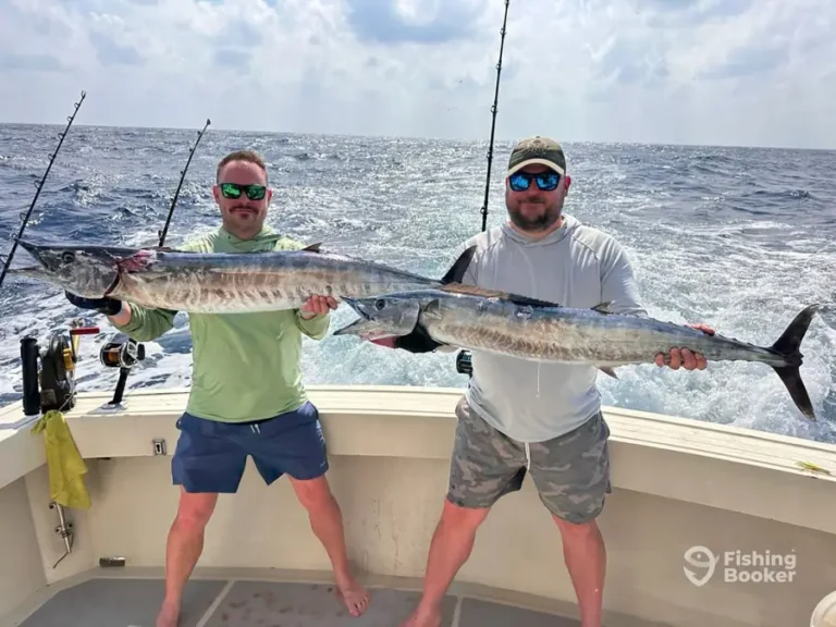 Guest with a large wahoo aboard Cape Escape