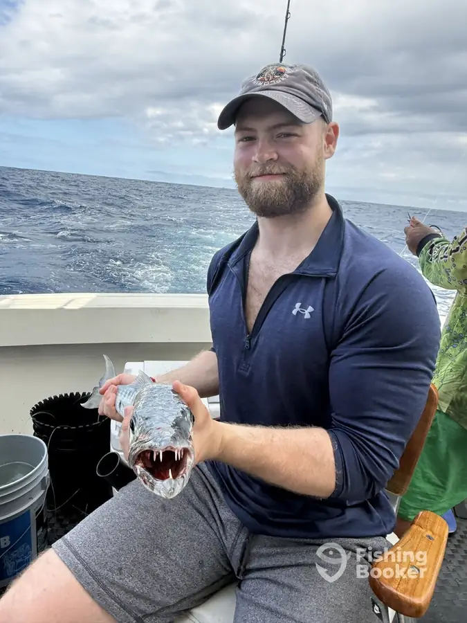 Guest with his catch aboard Cape Escape