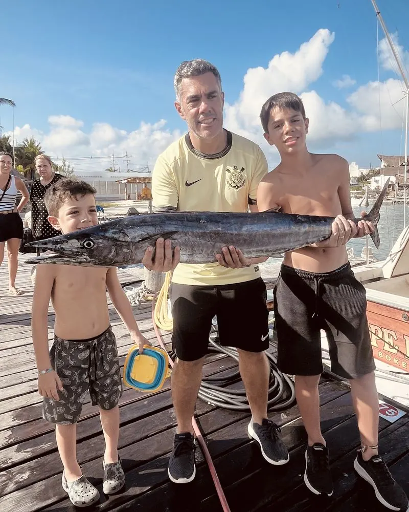 Family with a wahoo caught on Cape Escape