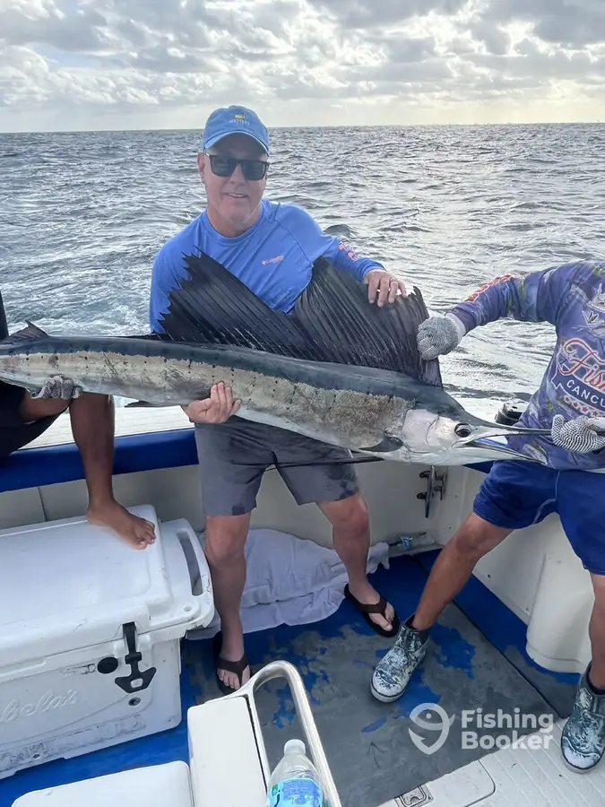Guest with a sailfish on the dock