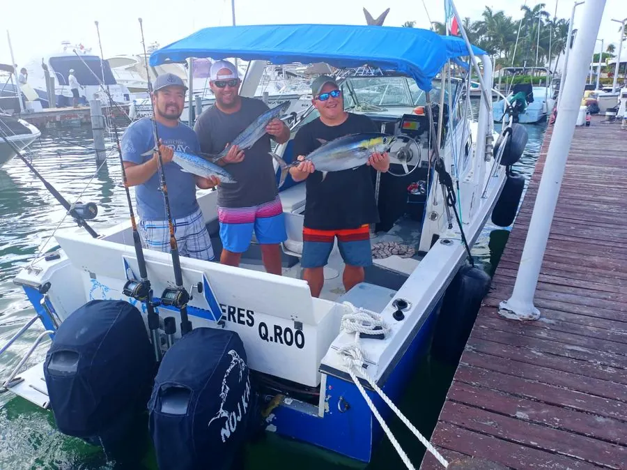Nuj Kay 24 ft fishing boat at the dock with guests