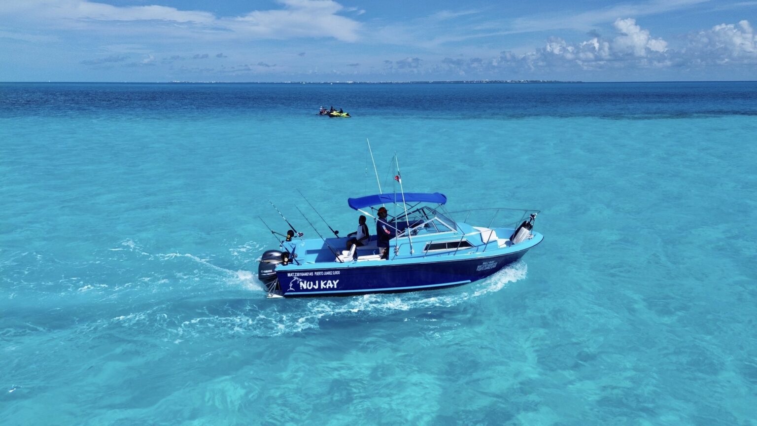 Nuj Kay 24 ft fishing boat at the dock with guests