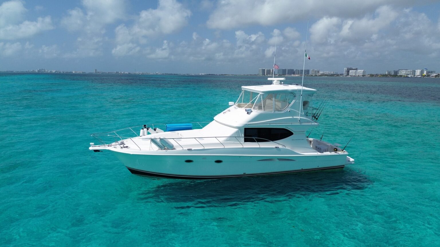 Totopo 49 ft Silverton fishing yacht on the water in Cancún