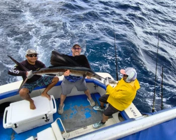Fish’s crew and guests with a sailfish in Cancún