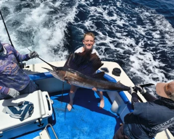 Guest with a sailfish aboard Fish’s in Cancún